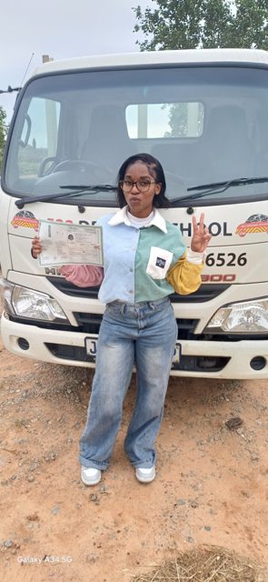 Learner with her licence at a 522 truck