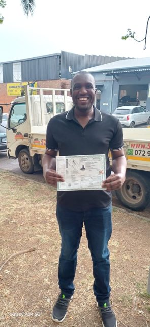 Happy learner with his licence